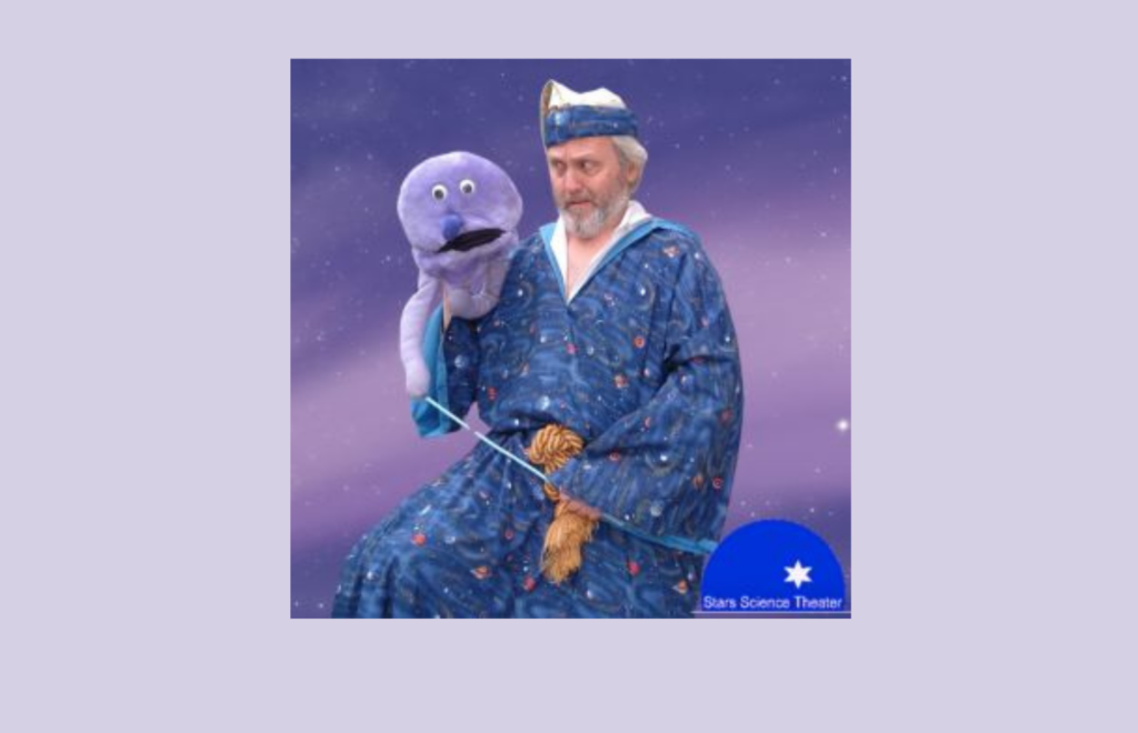 Man in wizard costume with puppet