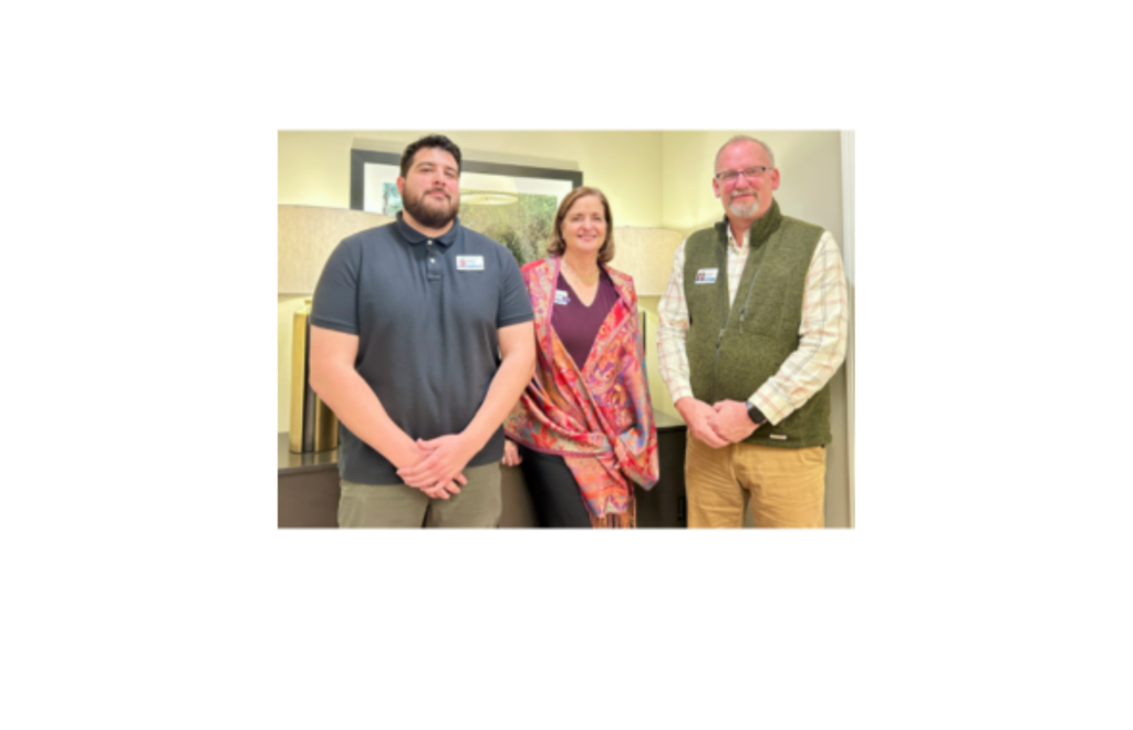 three people standing